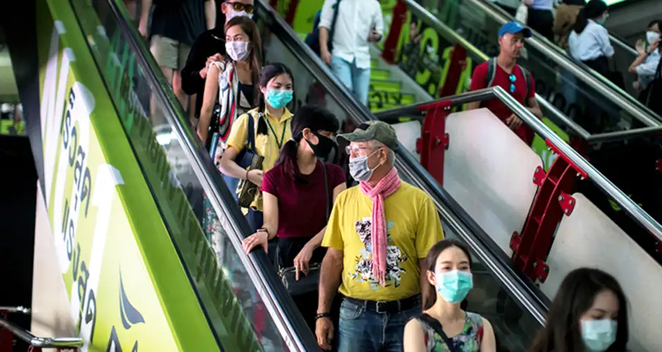 Tourists wearing face masks