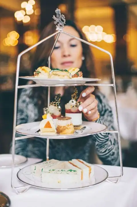 Woman is having her high tea