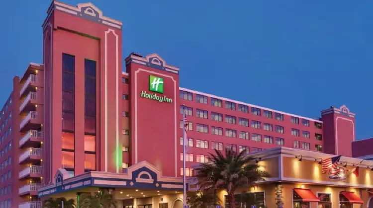Nighttime appearance of the hotel building in rose tones at Holiday Inn Ocean City
