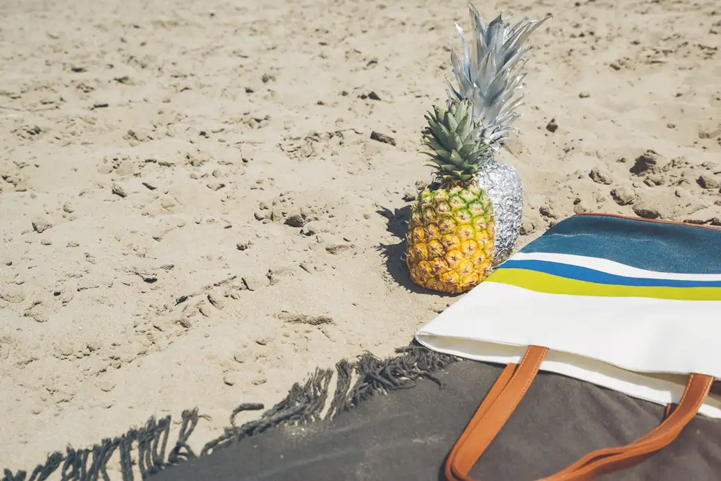 The beach tote can carry some surprising things, too... Source: Pineapple Supply Co / unsplash