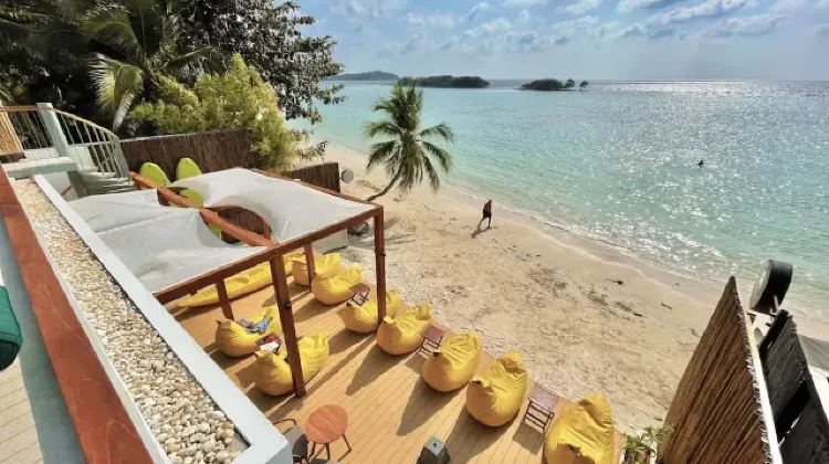 Beach area with tables and chairs at The Stay Chaweng Beach Resort