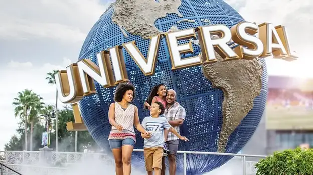 Family in front of Universal Studios Orlando sign