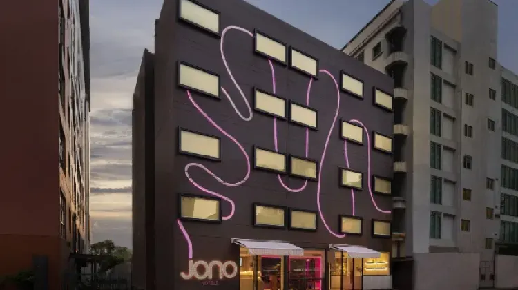 Lighted exterior of hotel building at night at Jono Bangkok Asok Hotel