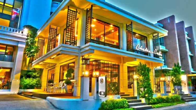 Lighted exterior of hotel building at night at Chateau de Sukhumvit