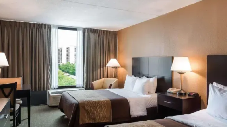 Simple style hotel room with two beds, table and chairs at Comfort Inn Gold Coast