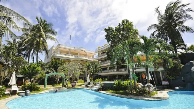 Tranquil outdoor swimming pool set in gardens at Paradise Garden Hotel and Convention Boracay Powered by Aston