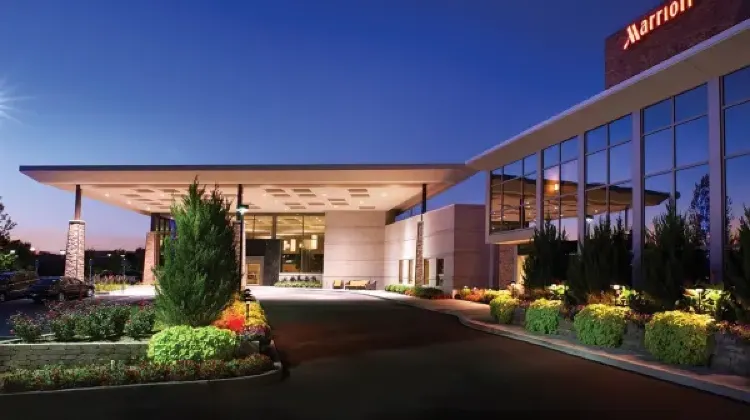 The appearance of the hotel building with lights on at night at Delta Hotels Indianapolis East