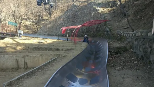 Ride a toboggan at Mutianyu