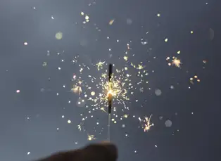 Closeup of person holding a sparkler
