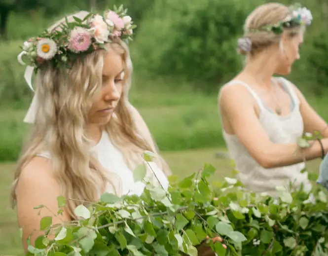 Women garlanded with May Day flowers. Source: David Biscuso / unsplash
