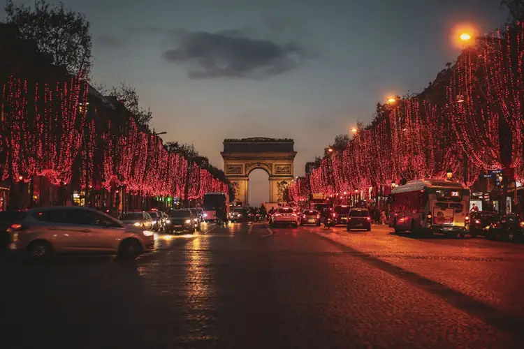 Source: Dyana Wing So/ unsplash  Take a stroll down Champs-Élysées in Paris, France for a romantic Christmas vacation