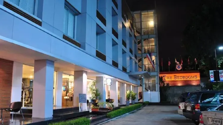 Lighted exterior of hotel building at night at The Bedrooms Boutique Hotel Bangkok