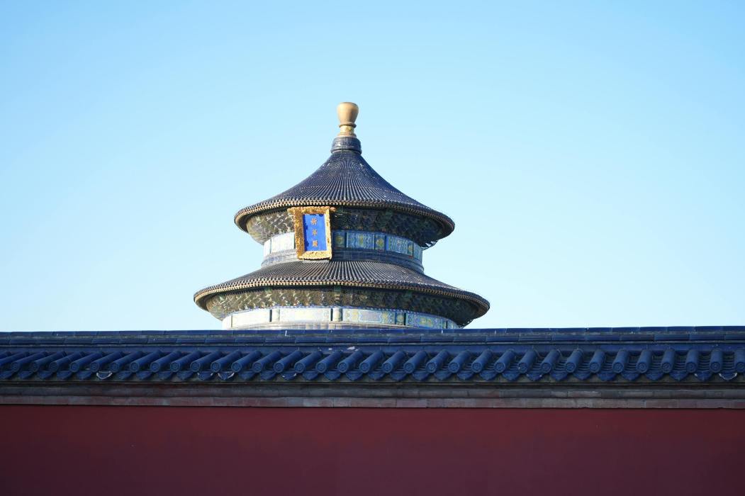 The Temple of Heaven in Beijing features intricate architecture against a bright blue sky. Via Pexels (by YiTian)