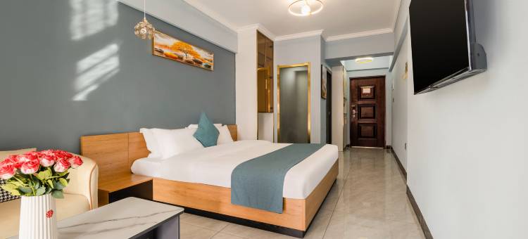 观山·鸣悦假日酒店(南宁东盟开发区客运站小帽山美食城店)图片