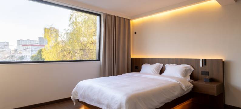 顾奈酒店(许昌胖东来时代广场曹魏古城店)图片