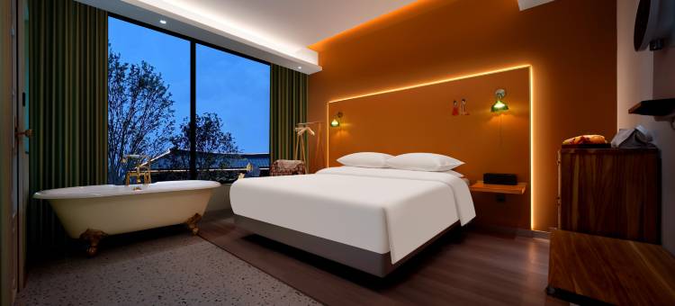 芊芊芒果树酒店(乐山大佛东大街美食街店)图片