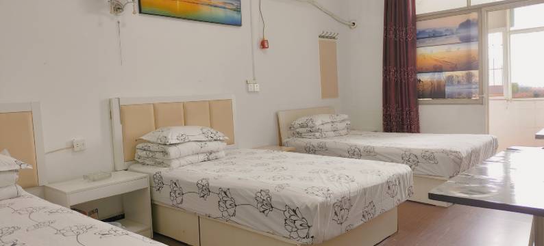 新港旅店(武汉纺织大学阳光校区江夏一中店)图片