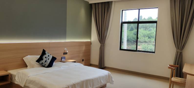 住一往酒店(禄劝转龙镇店)图片