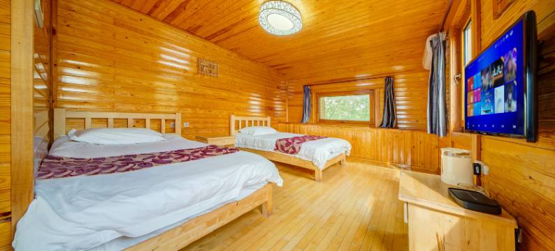 呼伦贝尔根河根林木屋宾馆图片