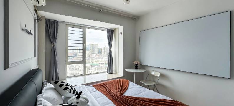 青岛归宿观影民宿(万达CBD店)图片