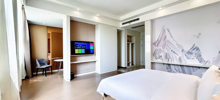 庐扉x酒店(中牟县人民政府易斯顿美术学院店)图片
