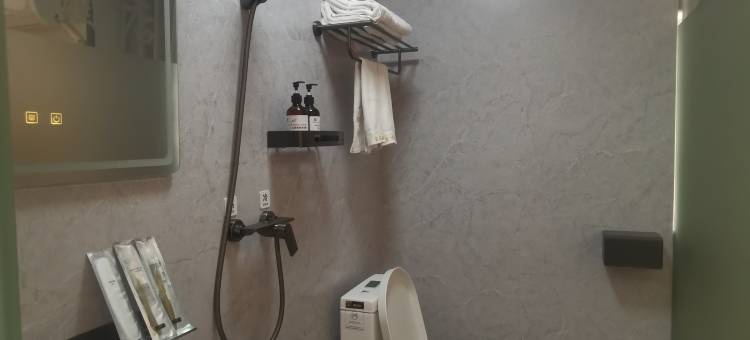 深圳金荷花商务酒店(坪山高铁站店)图片