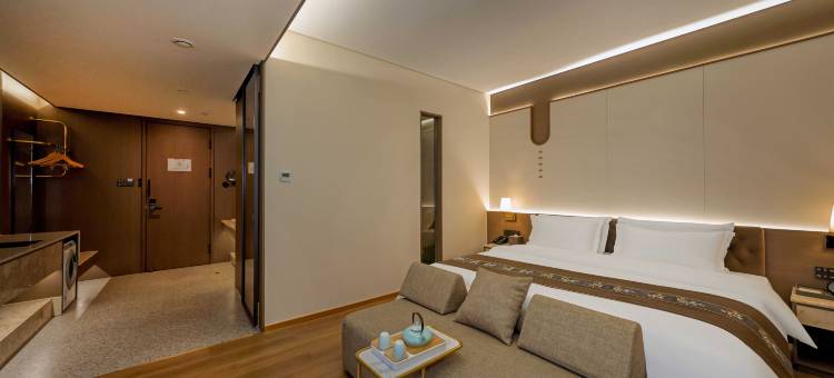 唯鑫锦中居酒店(锦州中央南街红星美凯龙店)图片