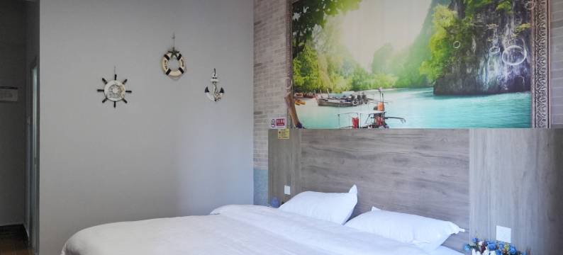 芒果御园酒店(景洪曼听公园店)图片