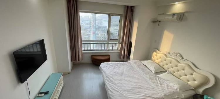 逸居民宿(开发区万达广场店)图片