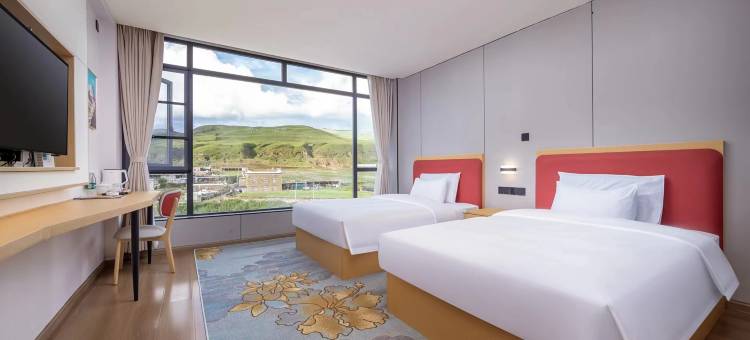 花美时酒店(甘孜道孚八美镇店)图片