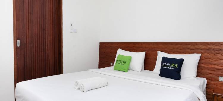 Urbanview Hotel Arta Guna Casa图片