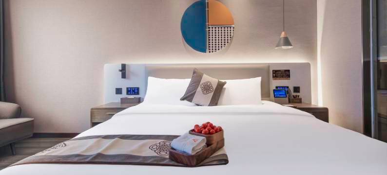 咖曼酒店(万象城六沟垅地铁站店)图片