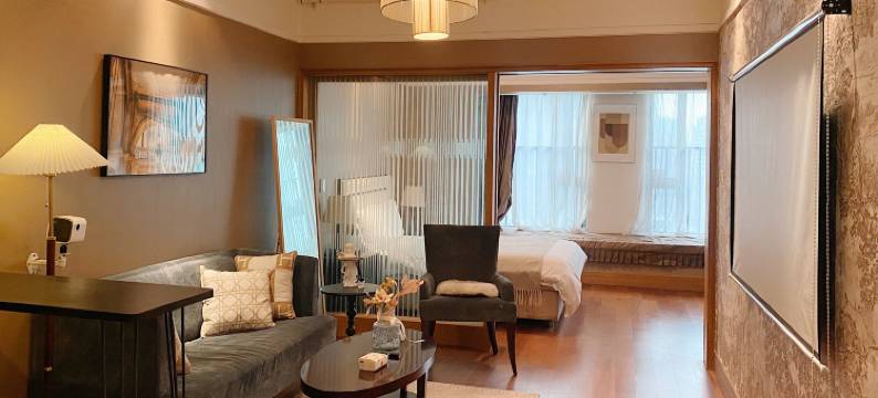 漫漫设计师民宿(观音桥步行街协信中心店)图片