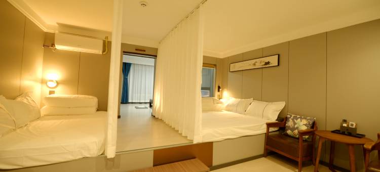 桔栀春天影院酒店(滨海家园店)图片