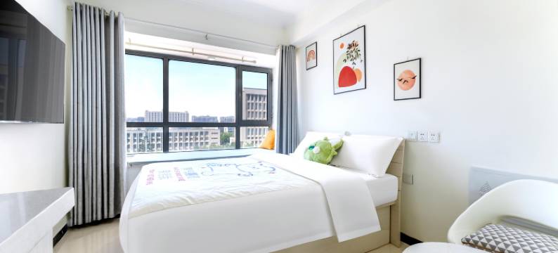 筑梦观影酒店(郑州大学新校区河南工业大学地铁站店)图片