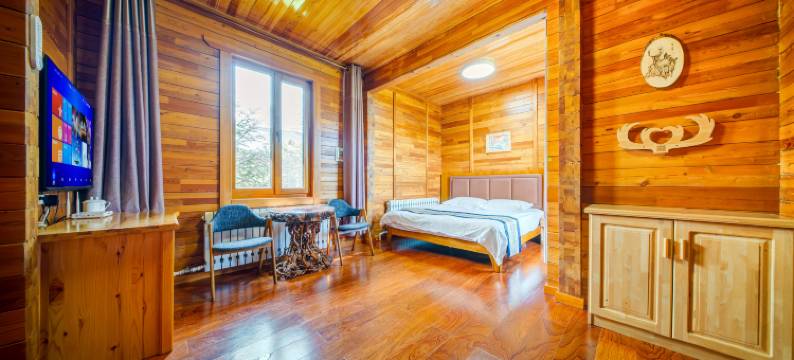 呼伦贝尔根河根林木屋宾馆图片