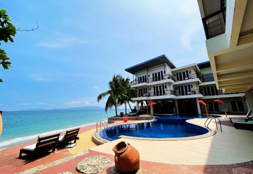 Sunset at Aninuan Beach Resort powered by Cocotel Hotel Overview