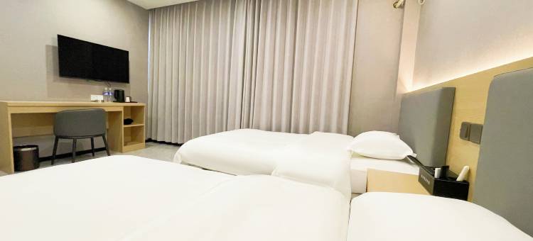 名成商务宾馆(汽开区二实验学校一汽店)图片