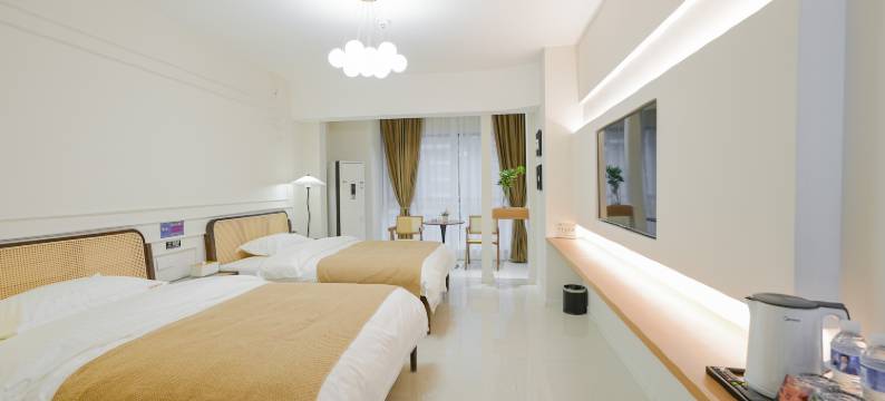 自然醒酒店(万达广场牡丹广场地铁站店)图片