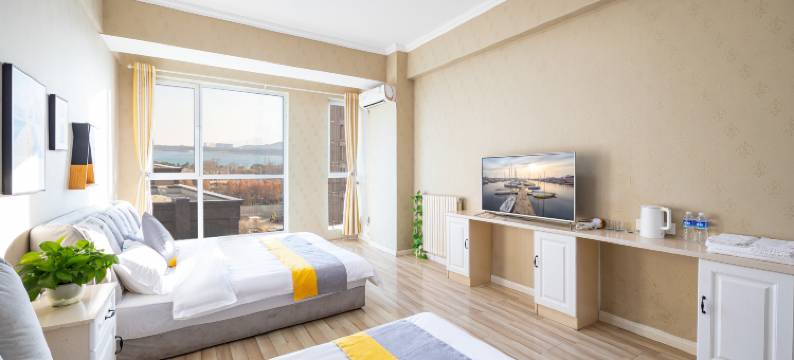 青岛木奕海景公寓(黄岛金沙滩城市传媒店)图片