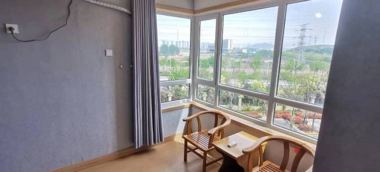 暖嘉旅舍(大季家高铁站蓬莱机场店)图片