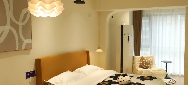 自然醒酒店(万达广场牡丹广场地铁站店)图片