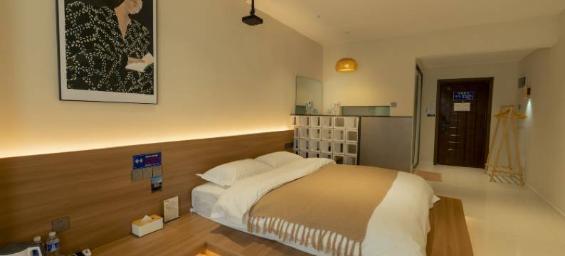 自然醒酒店(万达广场牡丹广场地铁站店)图片