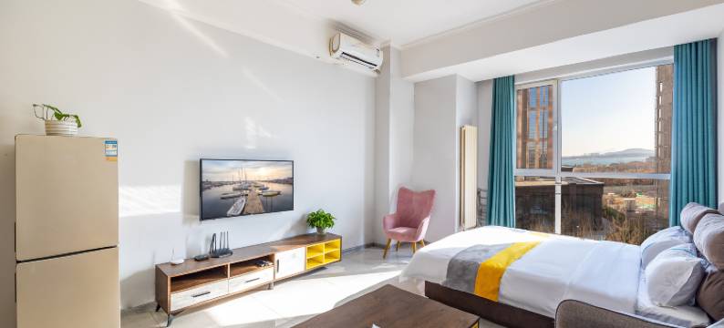 青岛木奕海景公寓(黄岛金沙滩城市传媒店)图片