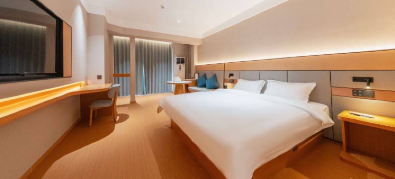 自然醒酒店(万达广场牡丹广场地铁站店)图片