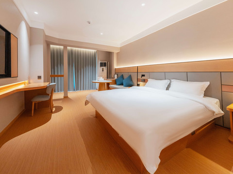 自然醒酒店(万达广场牡丹广场地铁站店)