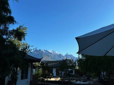 九相观山花园客栈(白沙雪山全景店)图片