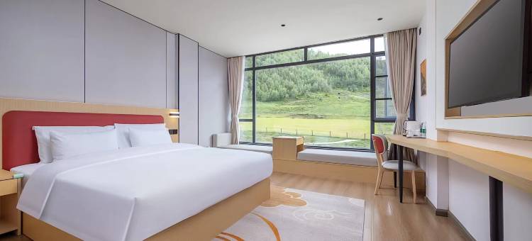 花美时酒店(甘孜道孚八美镇店)图片