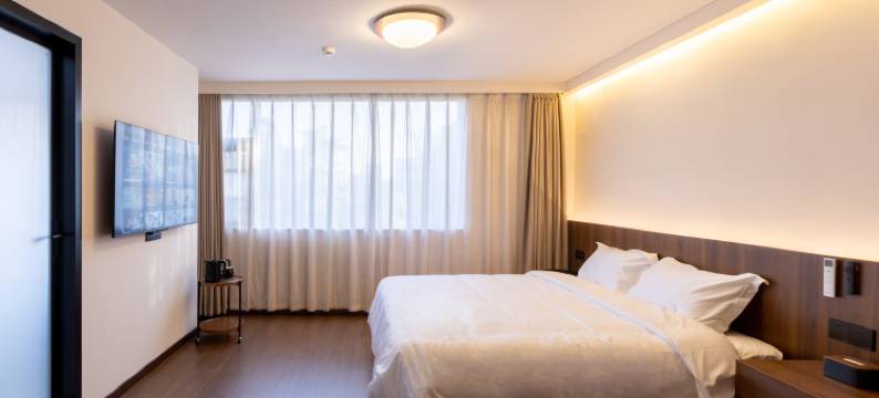 顾奈酒店(许昌胖东来时代广场曹魏古城店)图片