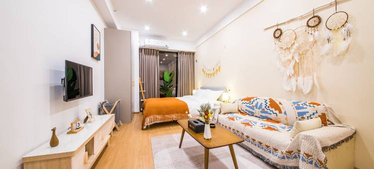 栖牛XINIU·投影自助公寓(乐山万达广场店)图片